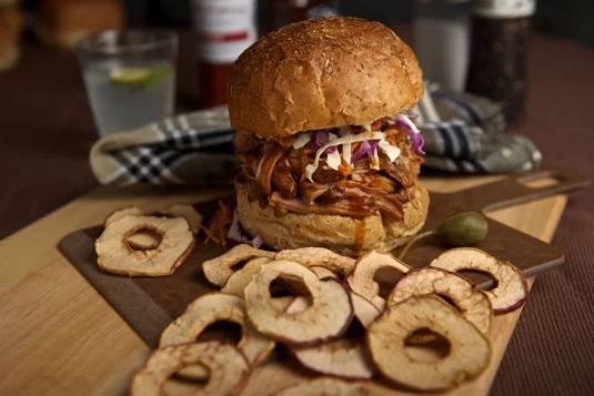 Crispy apple chips as a side to a pulled pork sandwich